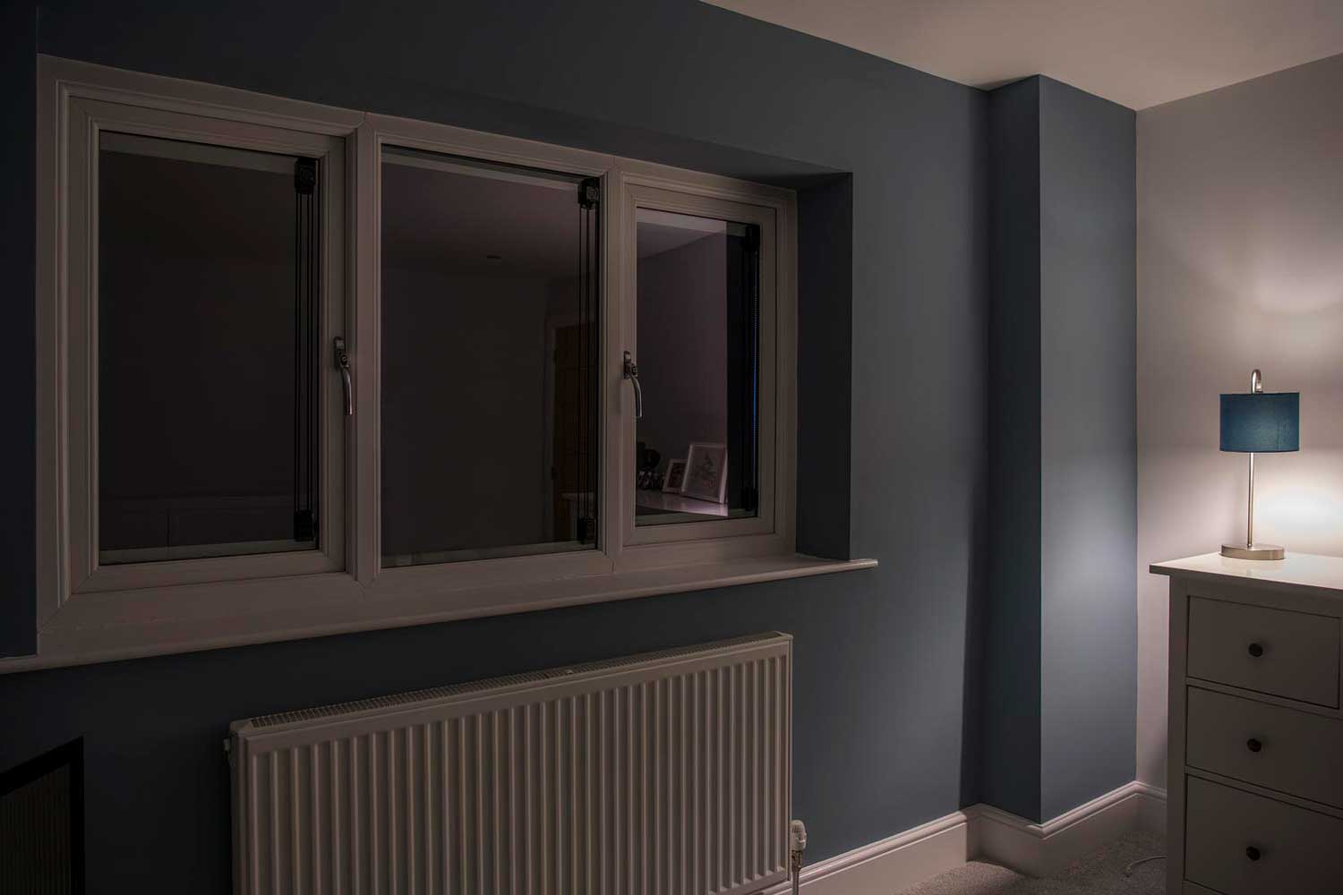 Blinds in Glass in Baldock: blackout integral blinds fully closed in a bedroom