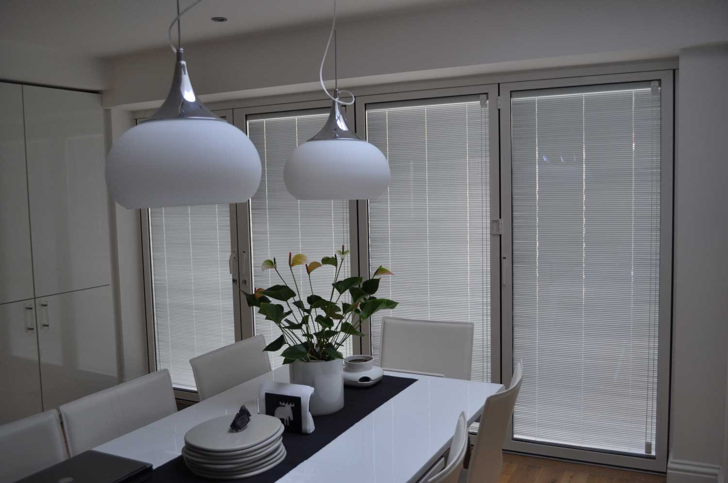 Blinds in Glass in Baldock: white integral blinds in dining-room French doors