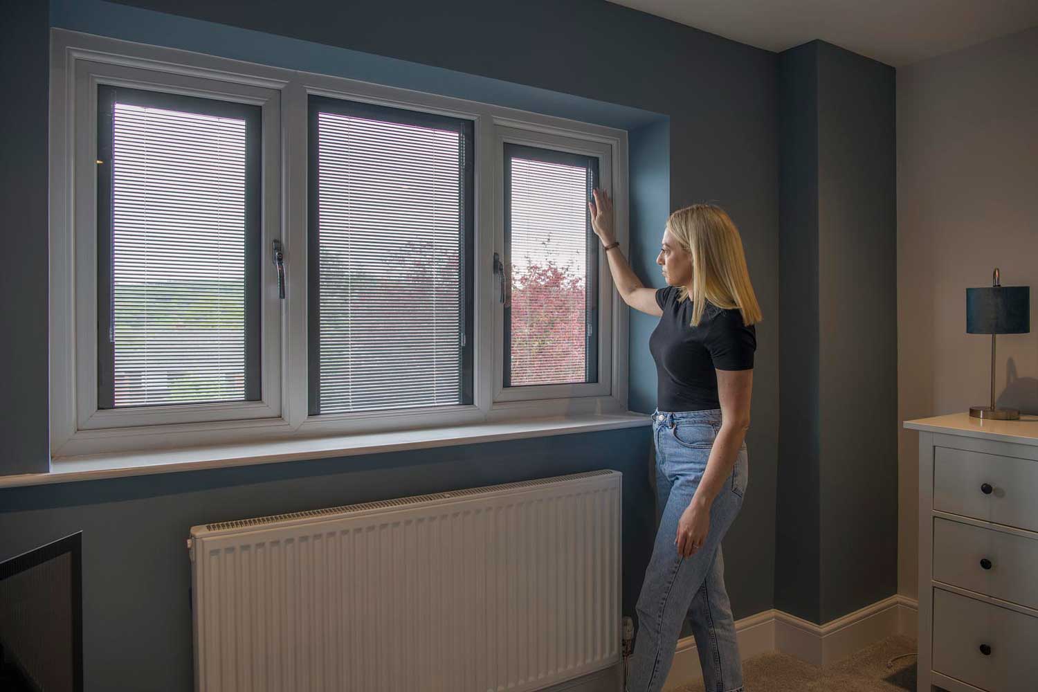 Blinds in Glass in Baldock: adjusting magnetically controlled integral blinds in a bedroom window
