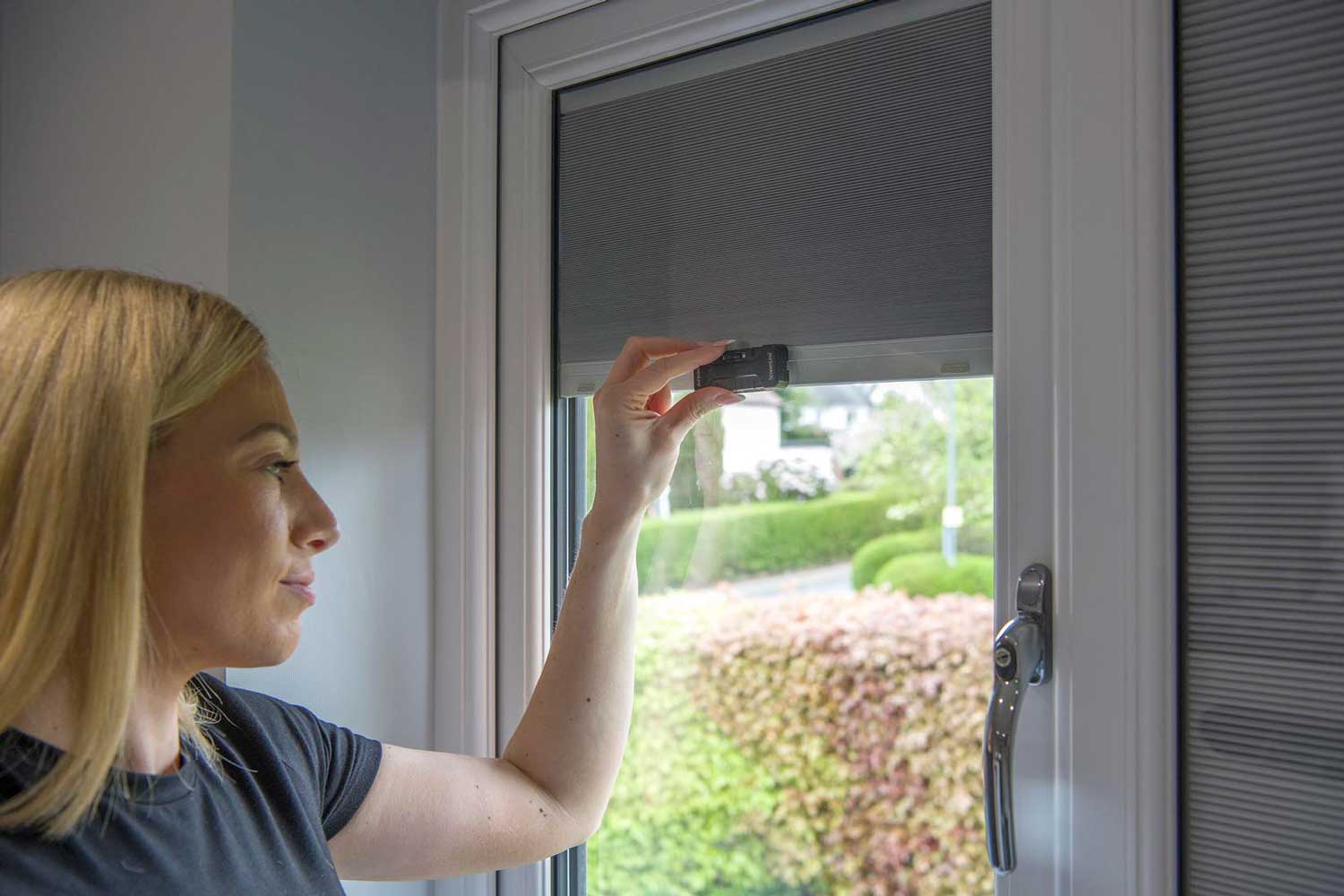 Blinds in Glass in Baldock: adjusting an integral blind with a manual slider control