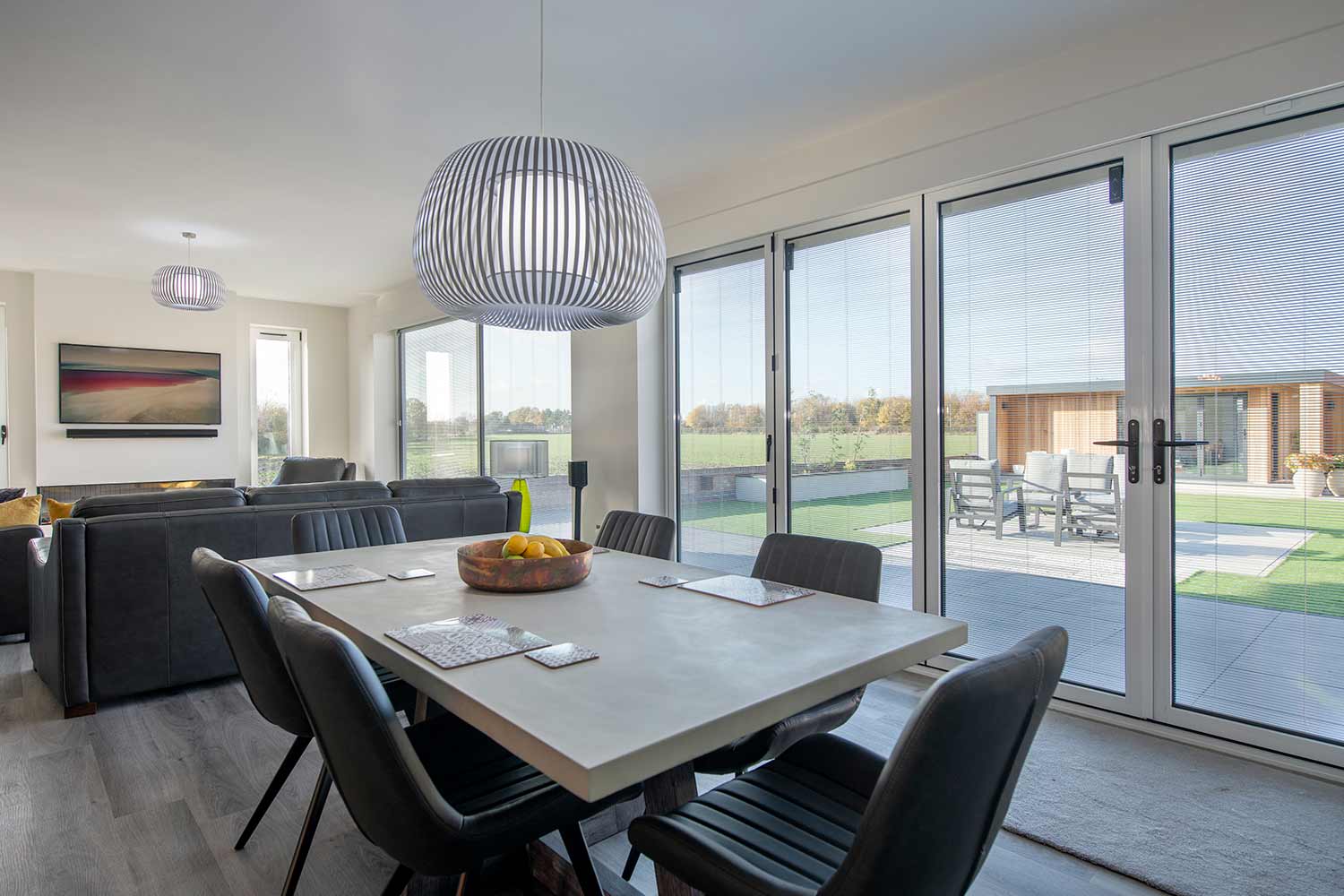 integral blinds in open-plan bifold and French doors with a countryside view, fitted in Baldock