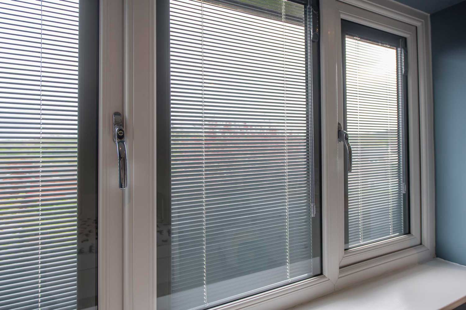 Blinds in Glass in Baldock: white venetian integral blinds in white French doors